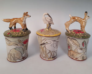 Fox store jar Earthenware decorated with  drawings of fox and little fox sculpture.