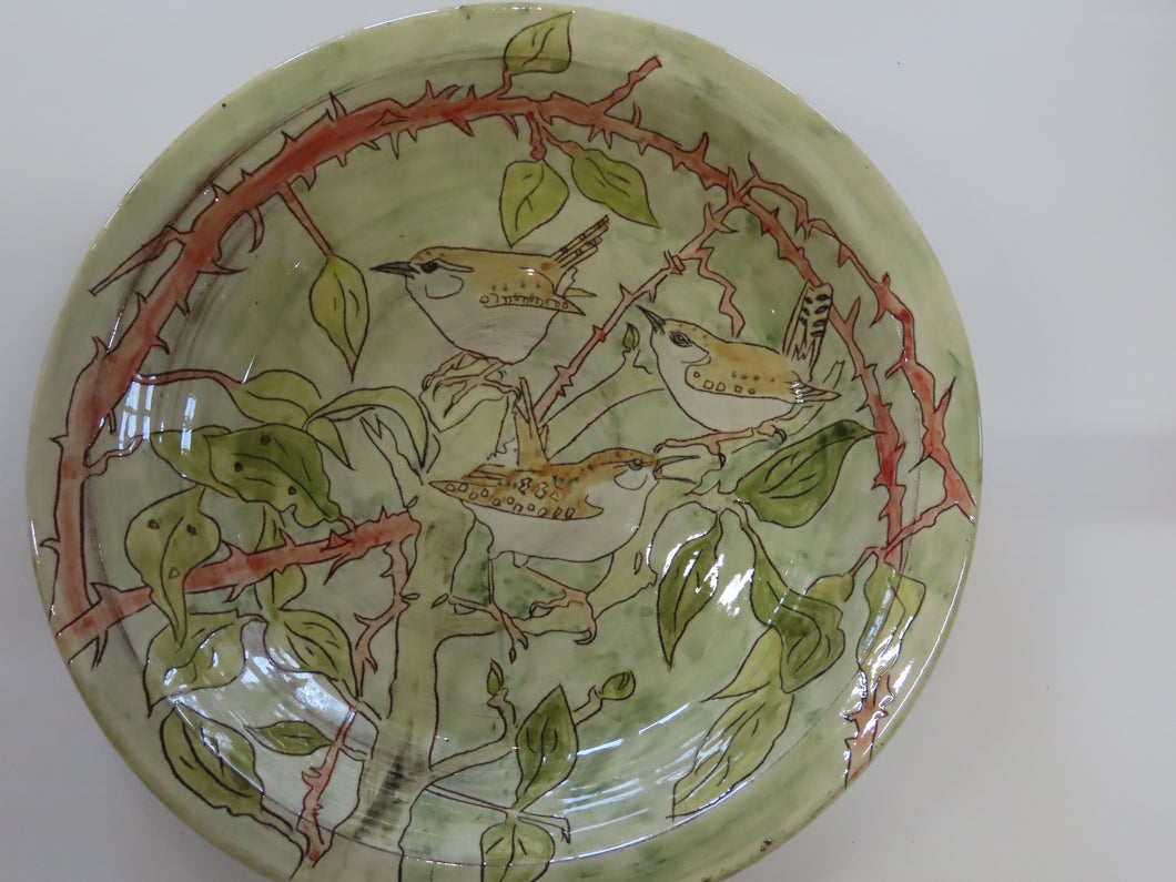 large dish depicting 3 wrens in Brambles