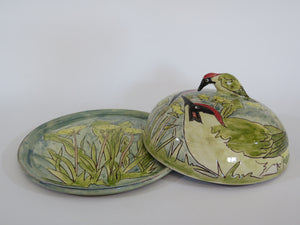 Butterdish depicting green woodpeckers